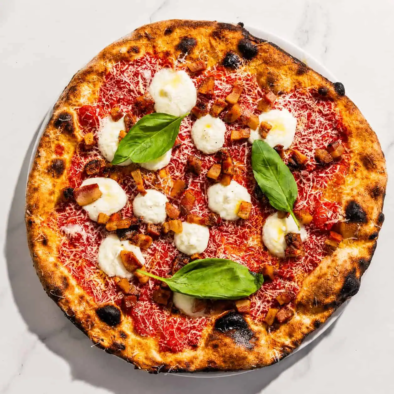 Amatriciana Pizza - San Marzano, Guanciale, Pecorino Romano, Basil, Coratina Extra Virgin Olive Oil
