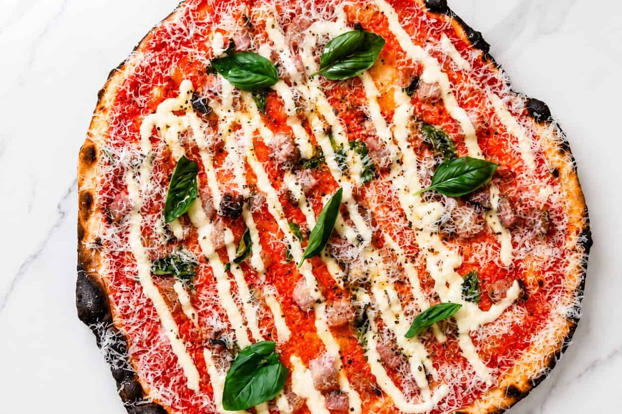 Amatriciana Pizza - San Marzano, Guanciale, Pecorino Romano, Basil, Coratina Extra Virgin Olive Oil