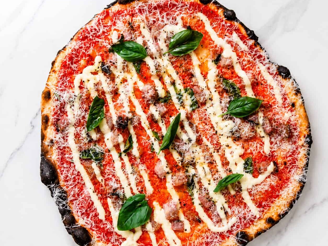 Amatriciana Pizza - San Marzano, Guanciale, Pecorino Romano, Basil, Coratina Extra Virgin Olive Oil