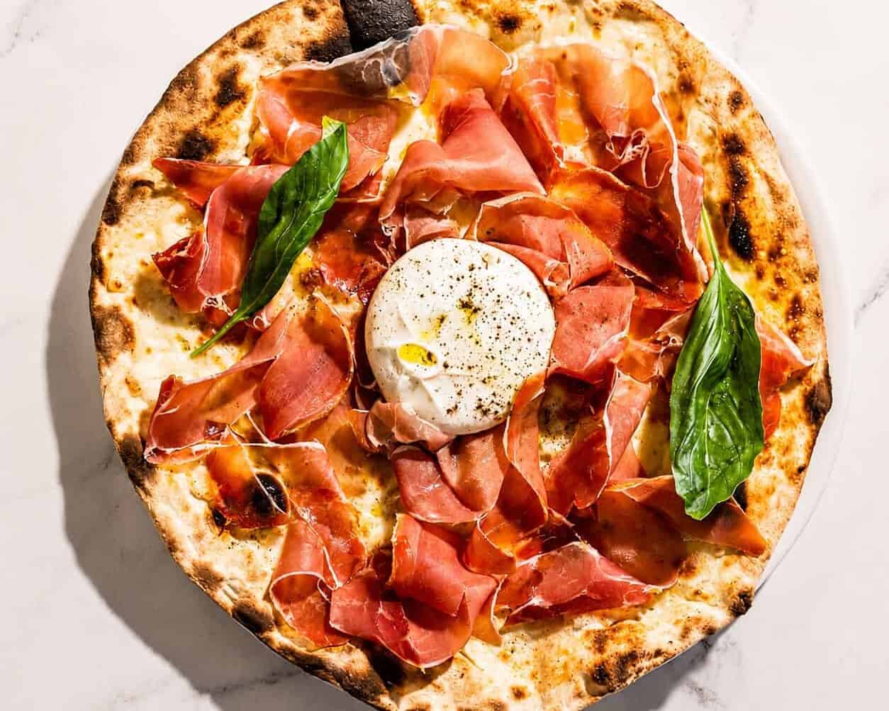 Burrata Pizza - San Marzano, Levoni Prosciutto San Daniele, La Stella Burrata, Basil, Coratina Extra Virgin Olive Oil