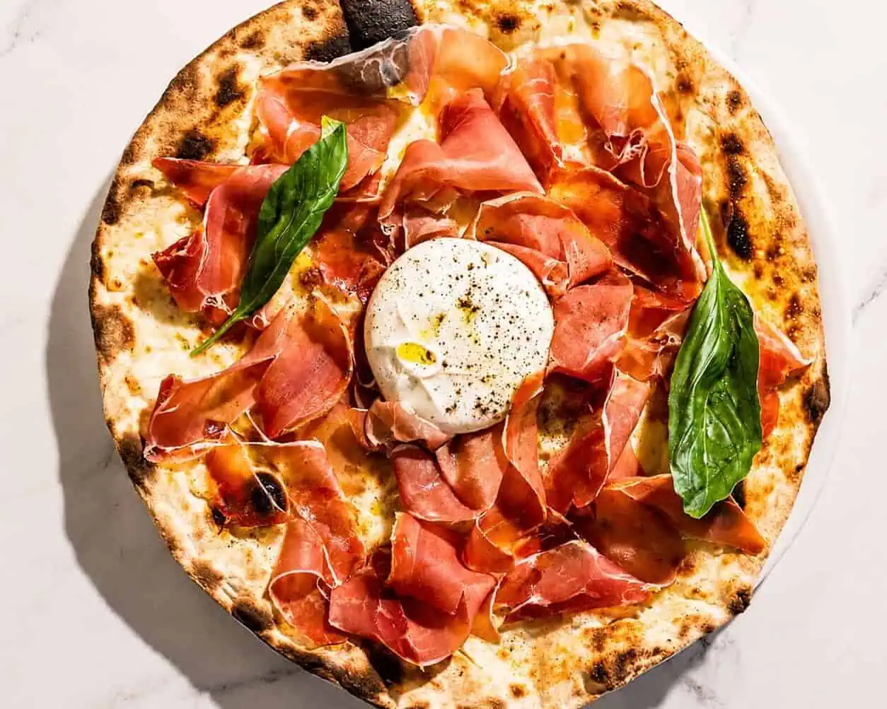 Burrata Pizza - San Marzano, Levoni Prosciutto San Daniele, La Stella Burrata, Basil, Coratina Extra Virgin Olive Oil