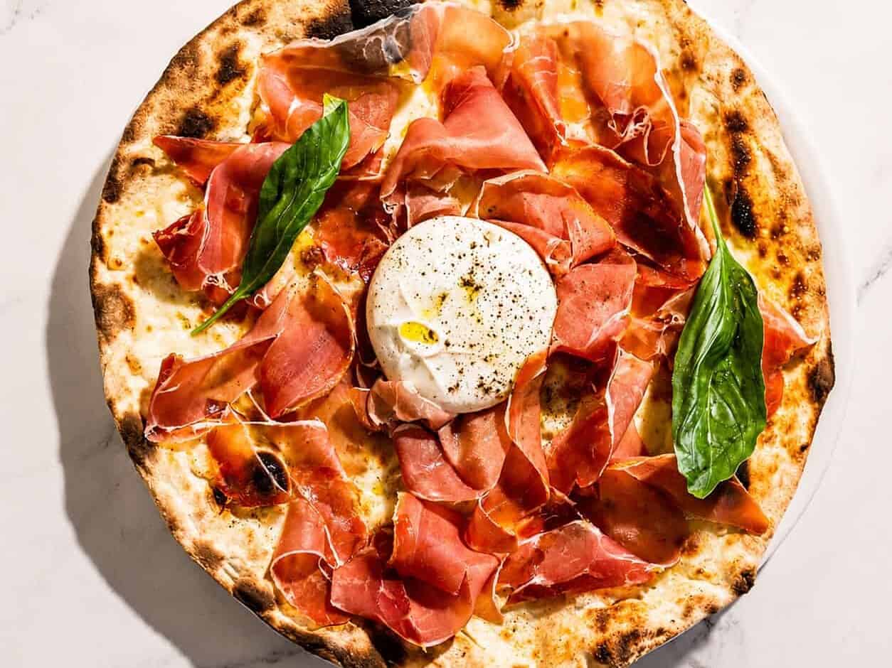 Burrata Pizza - San Marzano, Levoni Prosciutto San Daniele, La Stella Burrata, Basil, Coratina Extra Virgin Olive Oil