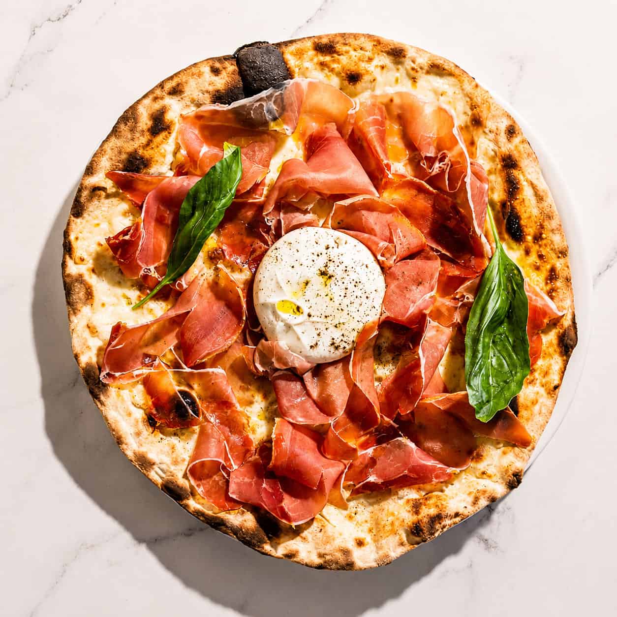 Burrata Pizza - San Marzano, Levoni Prosciutto San Daniele, La Stella Burrata, Basil, Coratina Extra Virgin Olive Oil