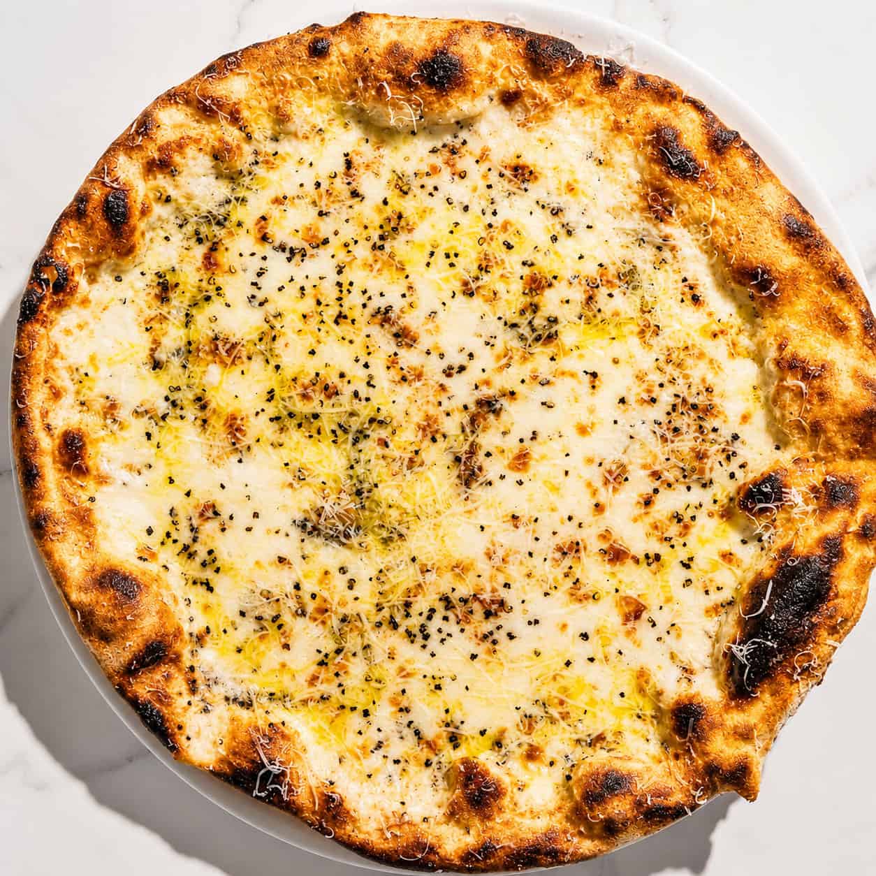 Cacio e Pepe Pizza - White Base, Pecorino Romano, Black Pepper