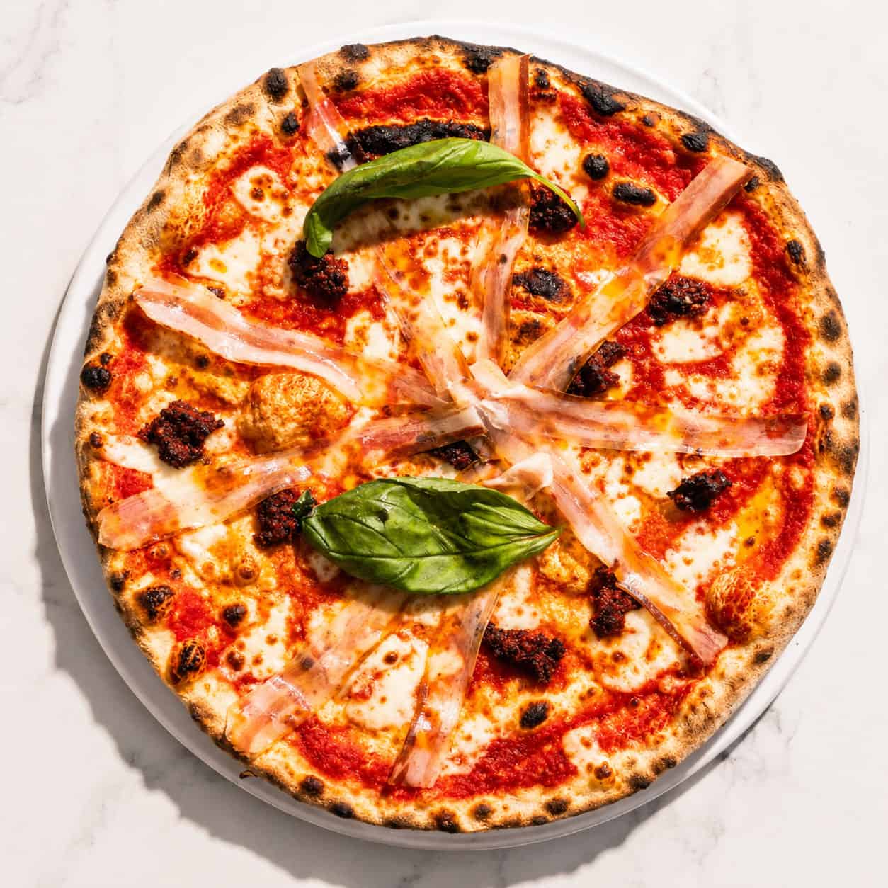 Calabrese Pizza - San Marzano, Buffalo Mozzarella, ‘Nduja, Pancetta, Basil, Coratina Extra Virgin Olive Oil