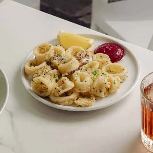 Flash-fried Hawkesbury River calamari served with lemon mayo – a crisp and tender Italian seafood starter