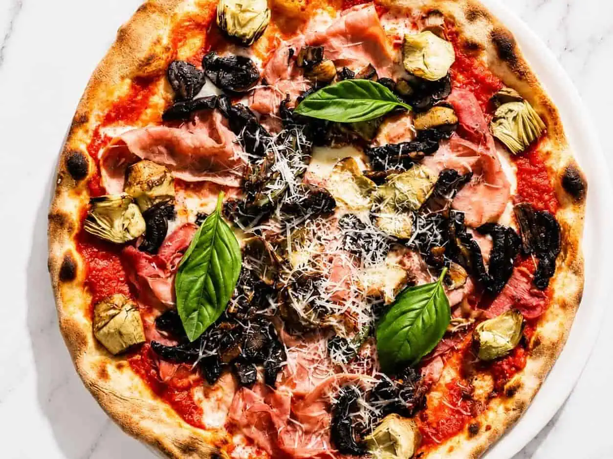 Capricciosa Pizza - San Marzano, Buffalo Mozzarella, Double Smoked Ham, Sautéed Mushrooms, Marinated Artichokes, Basil