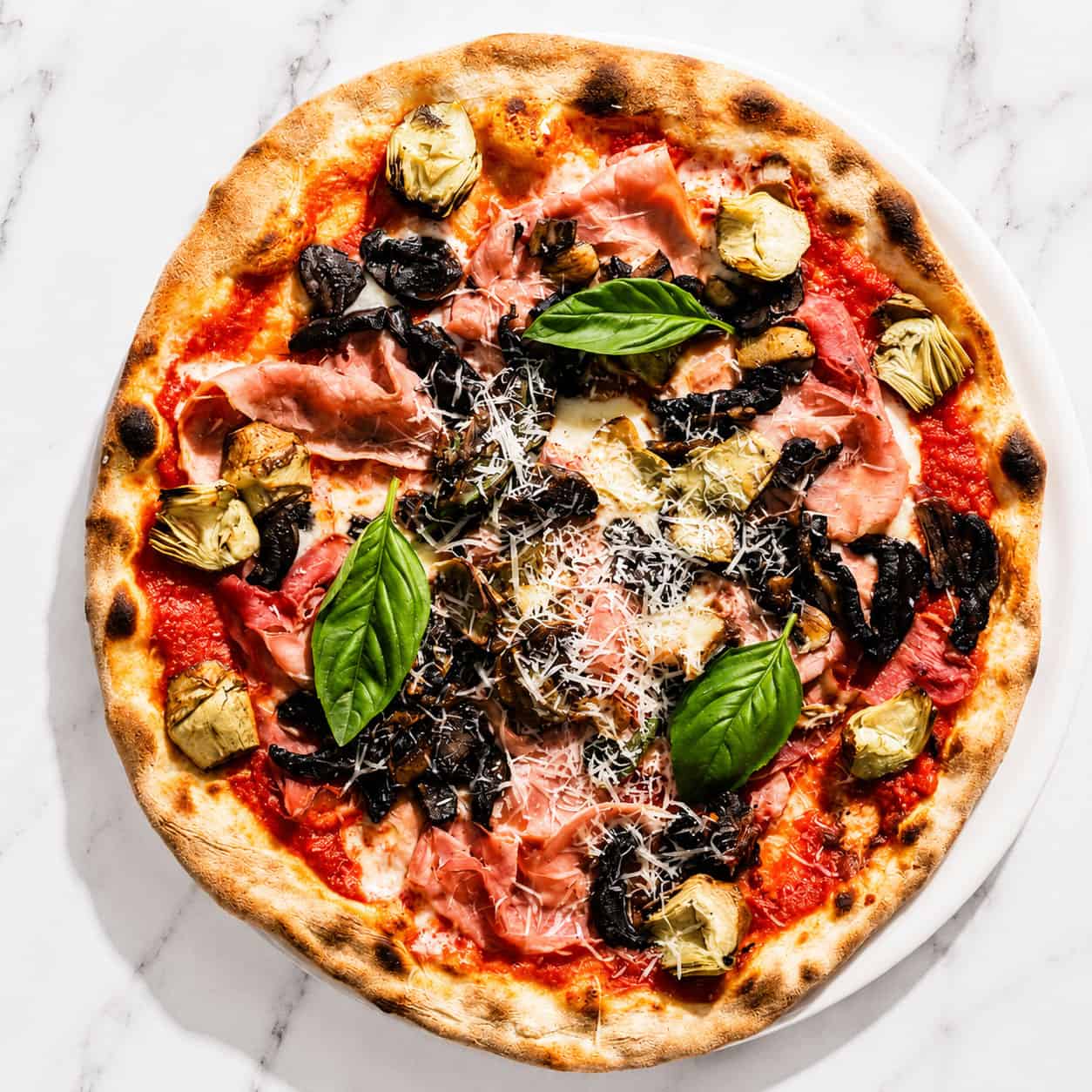 Capricciosa Pizza - San Marzano, Buffalo Mozzarella, Double Smoked Ham, Sautéed Mushrooms, Marinated Artichokes, Basil