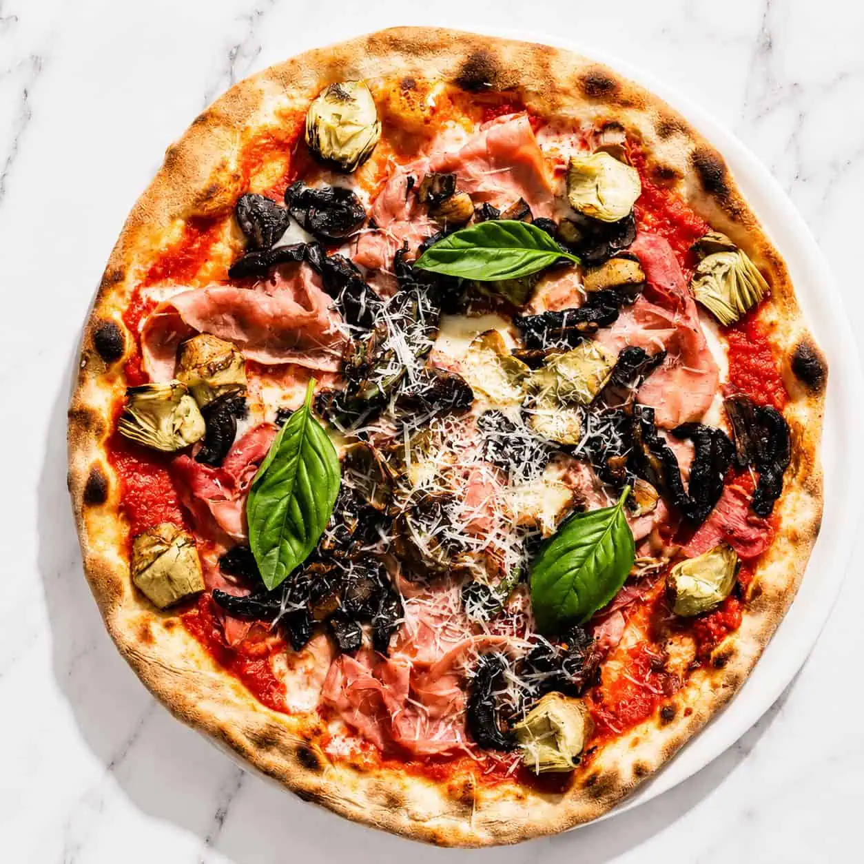 Capricciosa Pizza - San Marzano, Buffalo Mozzarella, Double Smoked Ham, Sautéed Mushrooms, Marinated Artichokes, Basil