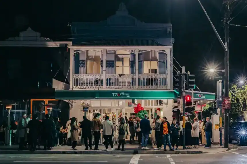 Crowd gathered outside 170 Grammi Italian restaurant in Surry Hills, Sydney at night, showcasing a vibrant dining atmosphere