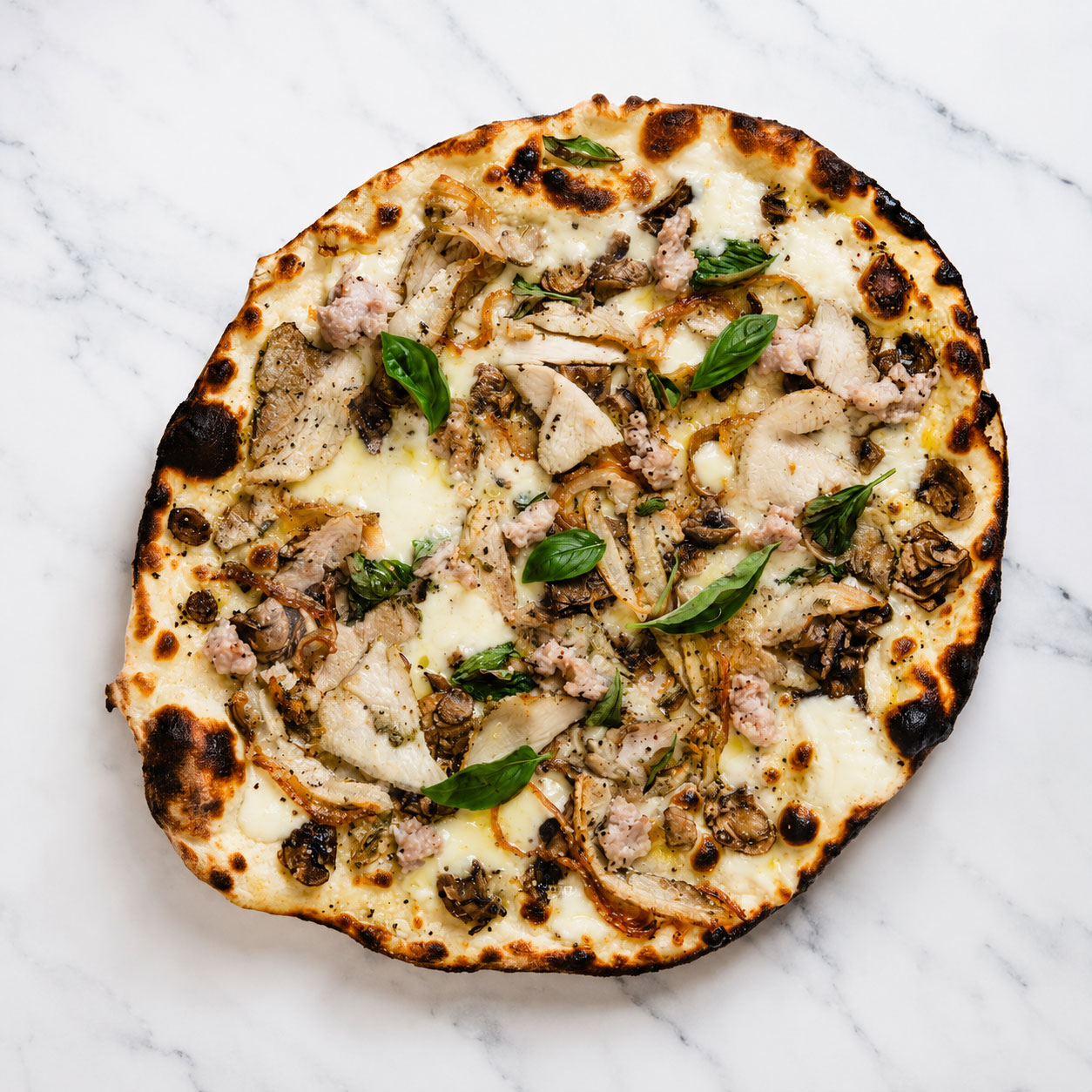 Fidasse è Bene, Magnà è Mejo Pizza - White Base, Fior di Latte, Porchetta alla Romana, Free-Range Pork Sausage, Mushrooms, Basil, Coratina Extra Virgin Olive Oil