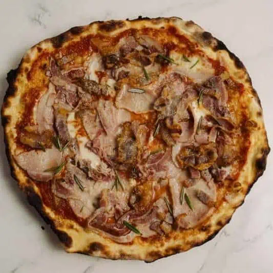 Meat lover’s Maialina pizza with San Marzano tomato, fior di latte, ham, pancetta, guanciale, and porchetta