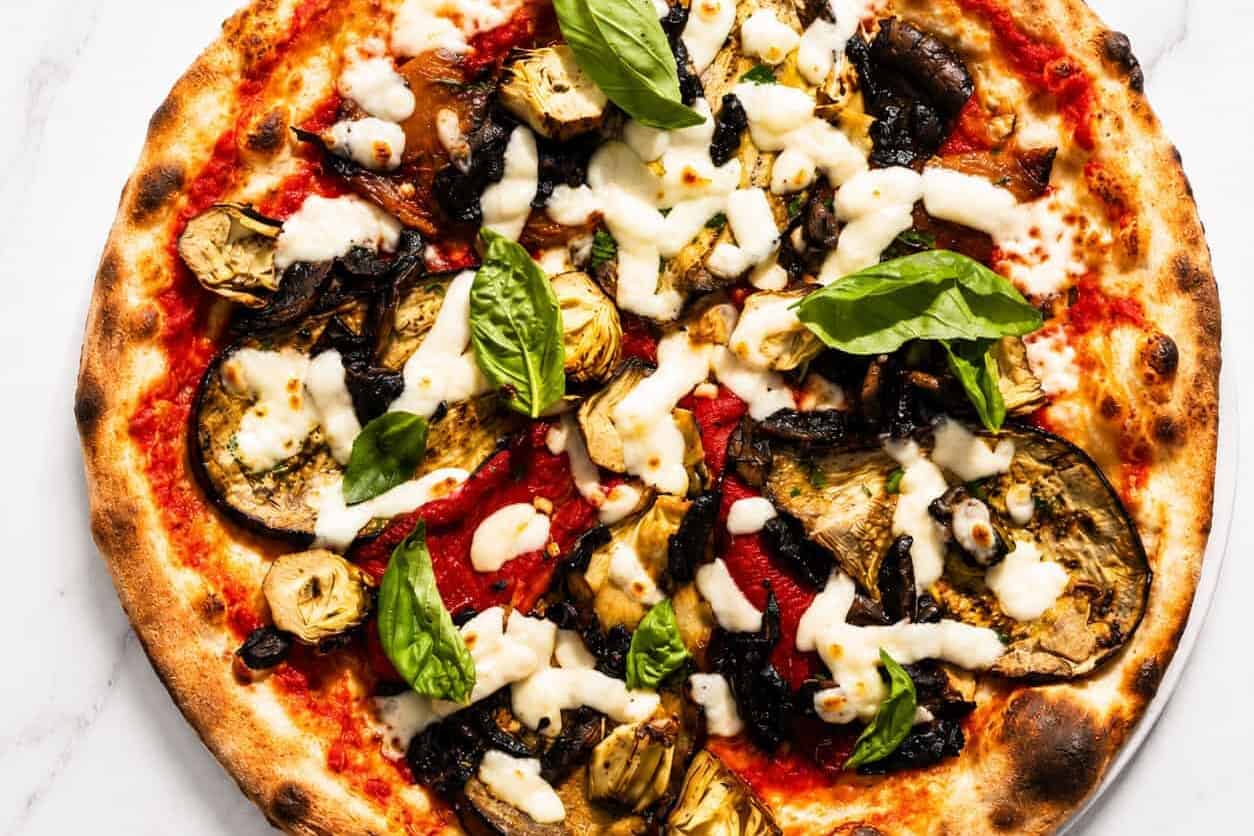 Ortolana Pizza - San Marzano, La Stella Buffalo Mozzarella, Sautéed Mushrooms, Grilled Capsicum, Marinated Artichokes, Wood-Fired Roasted Potatoes, Gaeta Black Olives, Basil, Coratina Extra Virgin Olive Oil