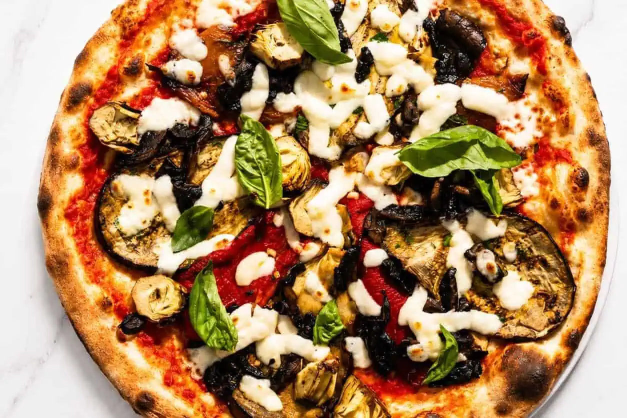 Ortolana Pizza - San Marzano, La Stella Buffalo Mozzarella, Sautéed Mushrooms, Grilled Capsicum, Marinated Artichokes, Wood-Fired Roasted Potatoes, Gaeta Black Olives, Basil, Coratina Extra Virgin Olive Oil