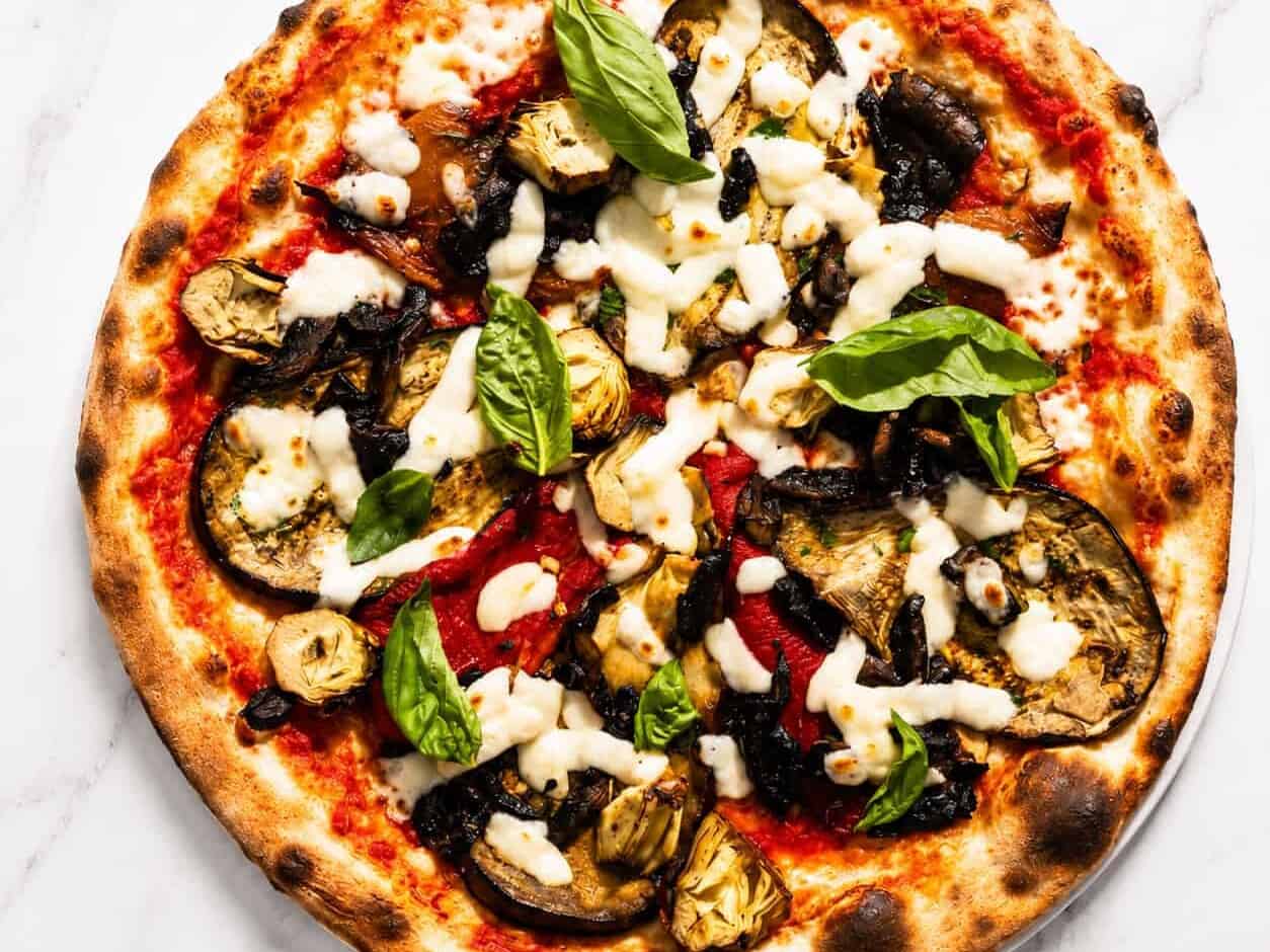 Ortolana Pizza - San Marzano, La Stella Buffalo Mozzarella, Sautéed Mushrooms, Grilled Capsicum, Marinated Artichokes, Wood-Fired Roasted Potatoes, Gaeta Black Olives, Basil, Coratina Extra Virgin Olive Oil