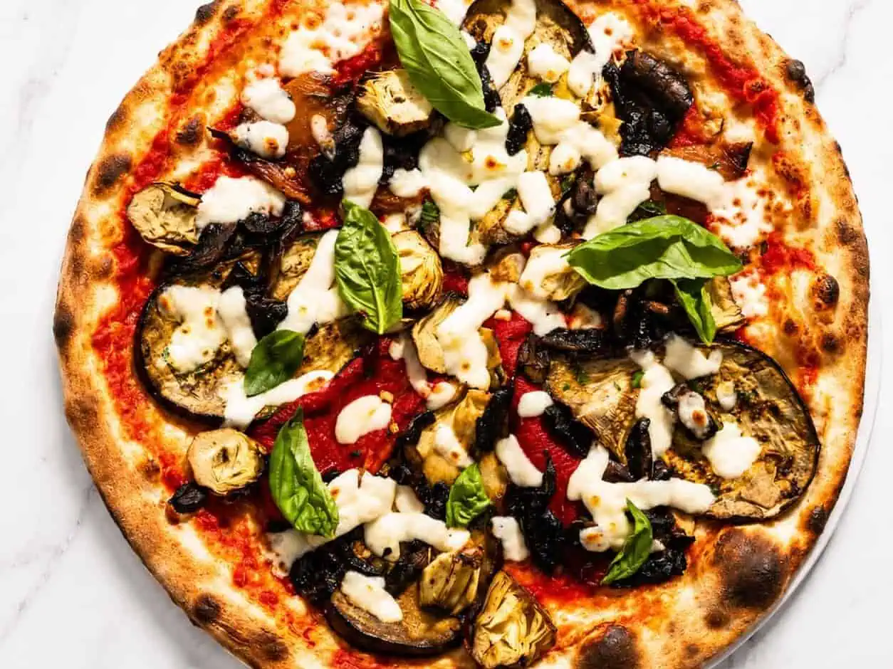 Ortolana Pizza - San Marzano, La Stella Buffalo Mozzarella, Sauté Mushrooms, Grilled Capsicum, Marinated Artichokes, Wood Fired Roasted Potatoes, Gaeta Black Olives, Basil, Coratina EVOO