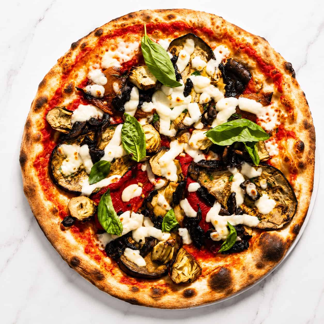 Ortolana Pizza - San Marzano, La Stella Buffalo Mozzarella, Sautéed Mushrooms, Grilled Capsicum, Marinated Artichokes, Wood-Fired Roasted Potatoes, Gaeta Black Olives, Basil, Coratina Extra Virgin Olive Oil