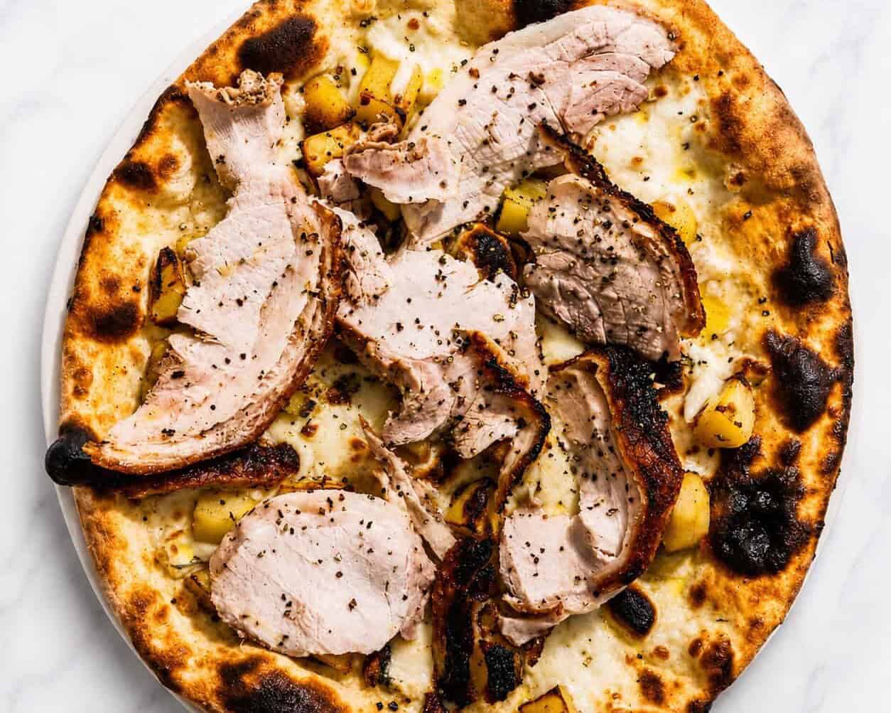 Porchetta di Ariccia Pizza - White Base, Porchetta alla Romana, Wood-Fired Roasted Potatoes, Rosemary, Black Pepper