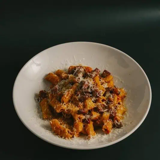 Traditional Roman rigatoni all’Amatriciana with San Marzano tomatoes, guanciale, Pecorino Romano, chilli, black pepper, and EVOO