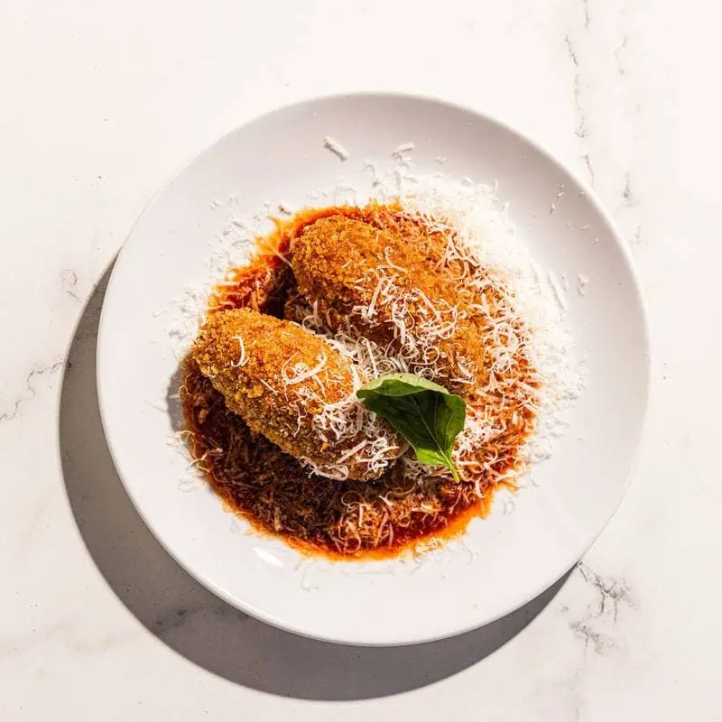 Crispy Roman-style supplì al telefono made with San Marzano tomato, La Stella buffalo mozzarella, and Pecorino Romano cheese
